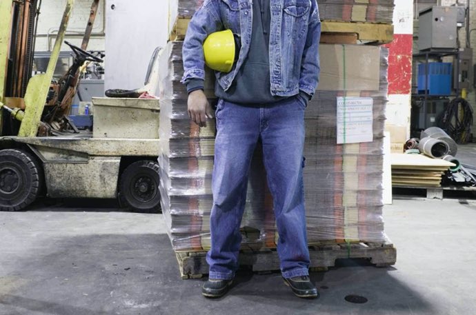 man wearing shoes standing on concrete floor