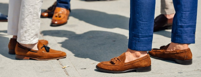men socializing wearing casual shoes